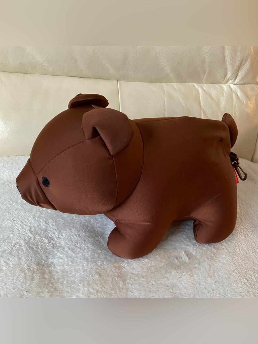 Kikkerland Brown Plush Toy / neck pillow.